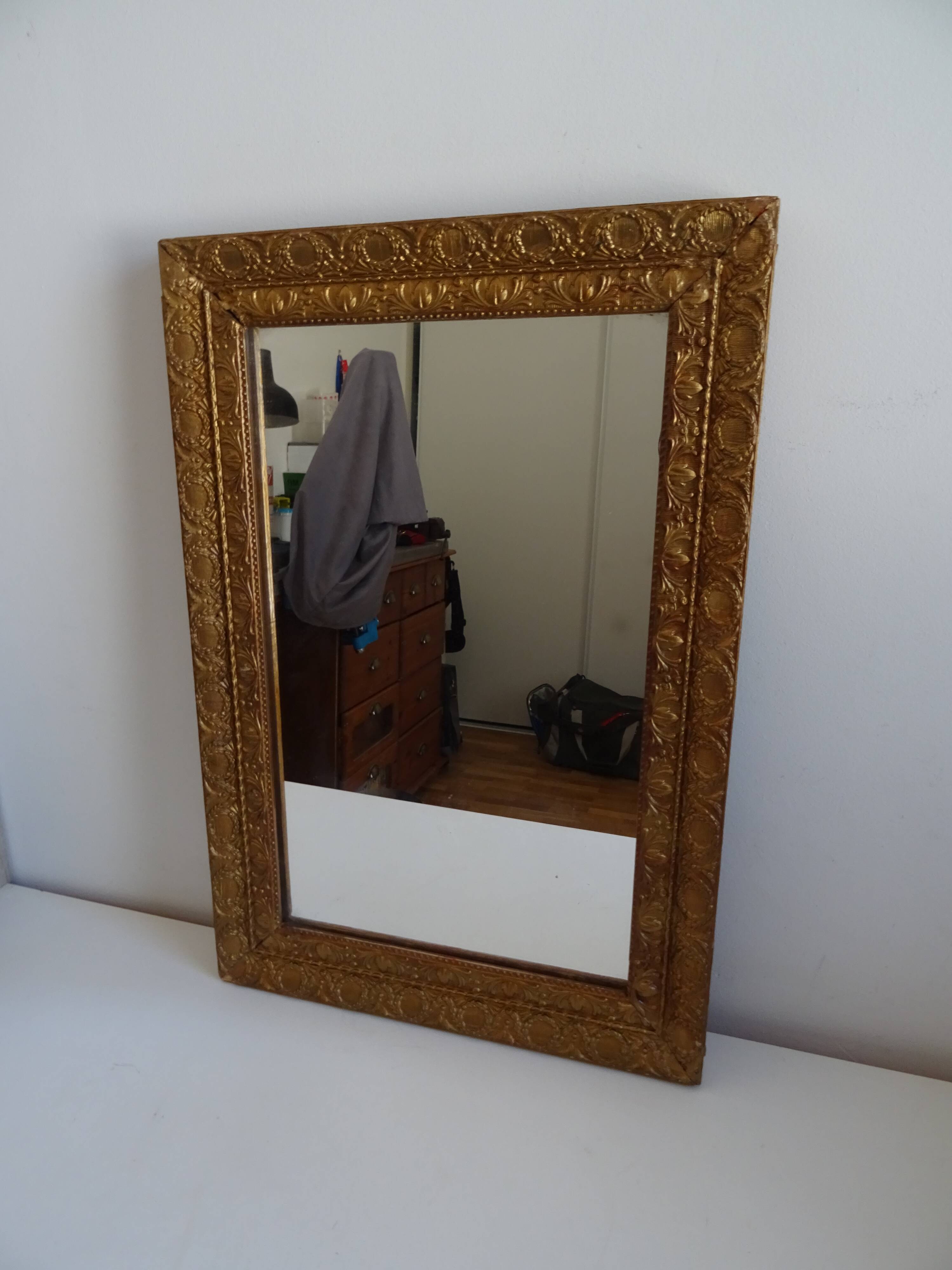 Wood and gilded stucco wall mirror
