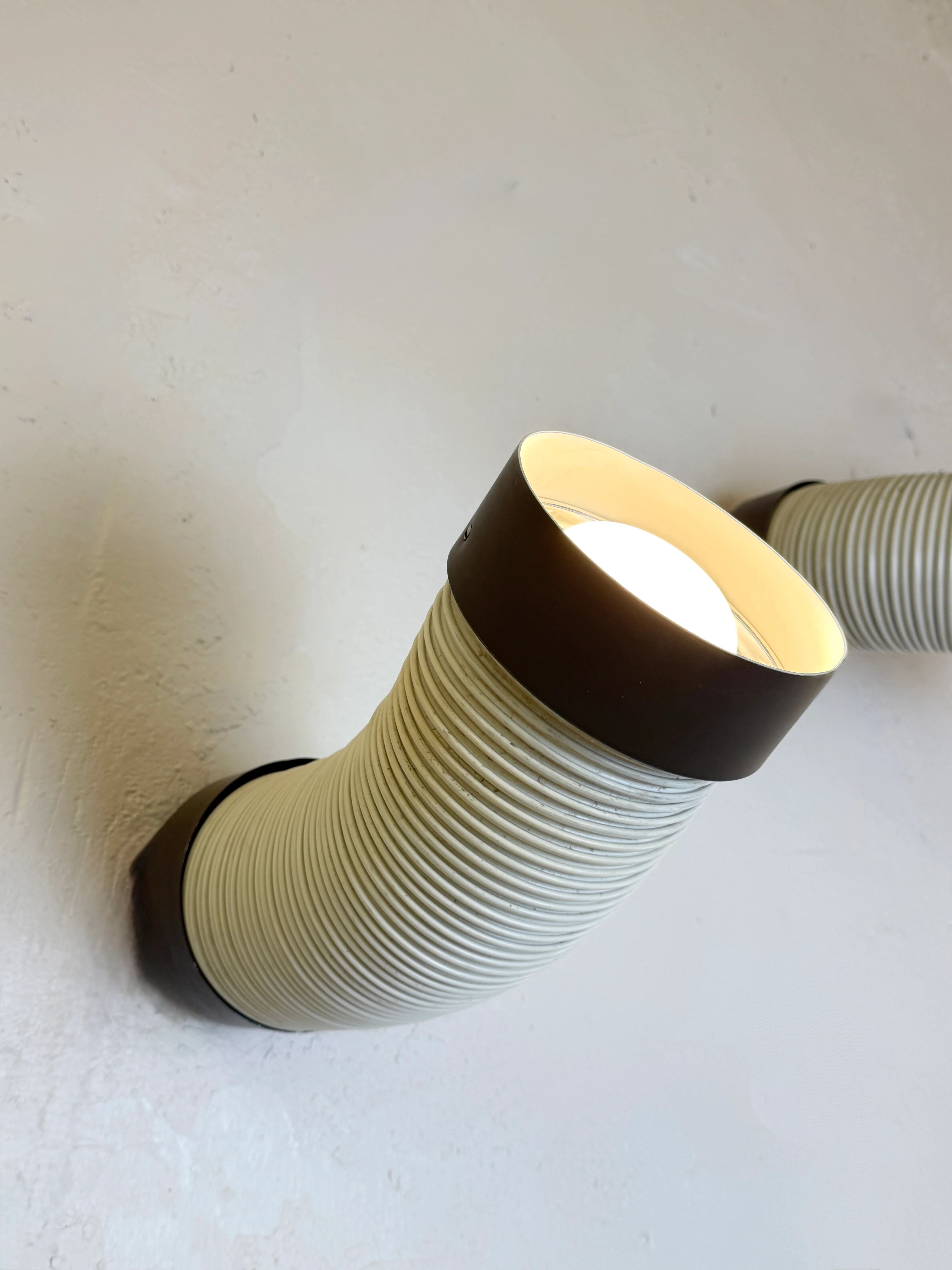 Pair of adjustable wall lights "Tuyau" by Raak, 1970s