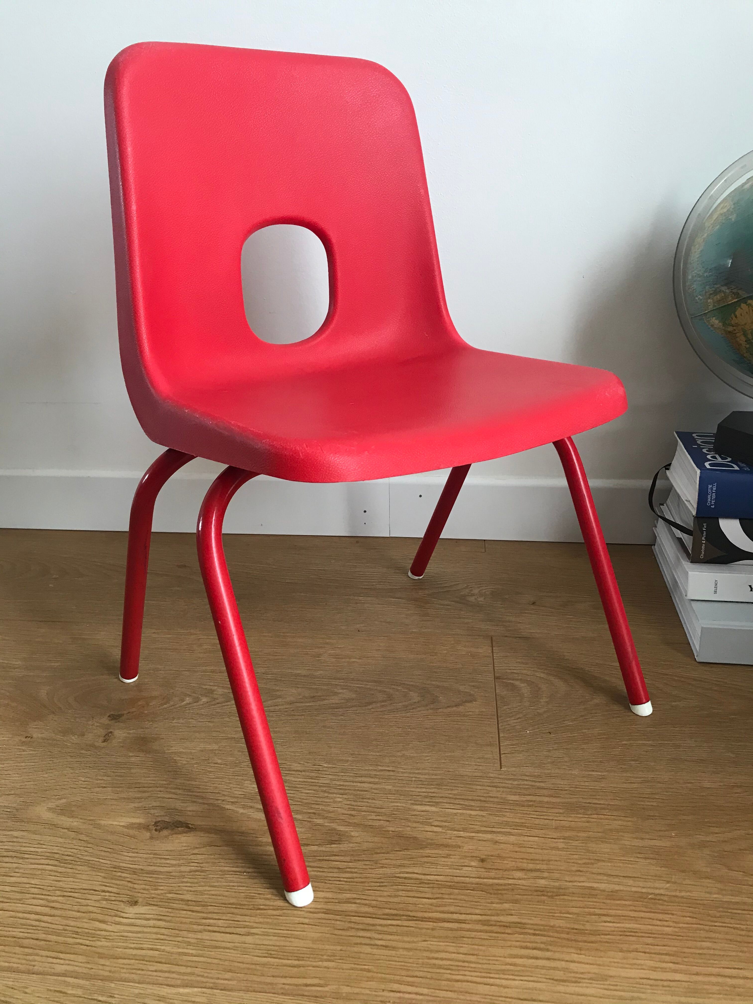 Red child chair by robin day for ikea