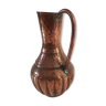 Pitcher-shaped vase in hammered copper