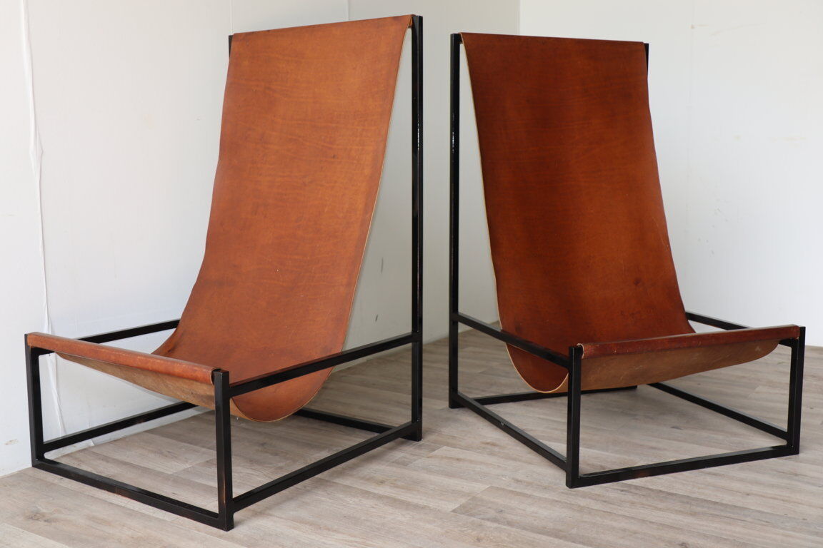 Pair of vintage armchairs in stretched leather and metal structure