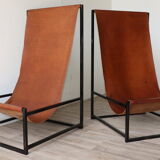 Pair of vintage armchairs in stretched leather and metal structure
