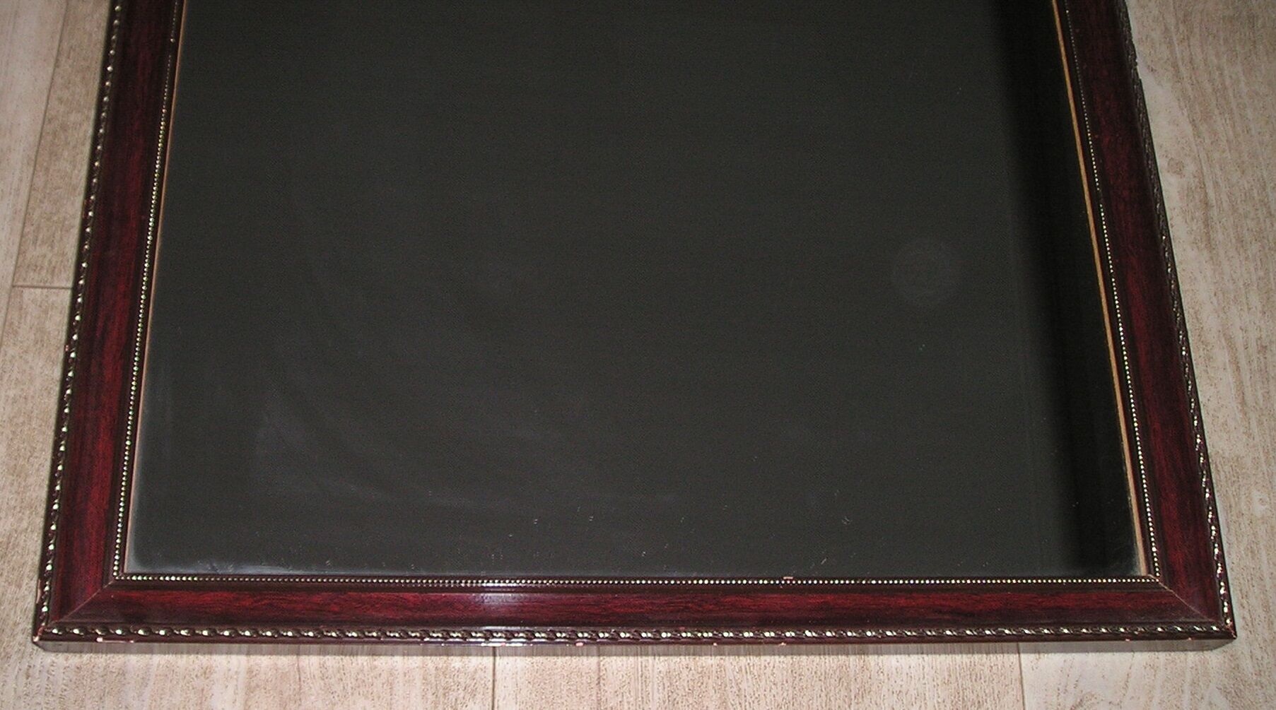 Contemporary wooden mirror enhanced with 2 brass frames 45x54cm