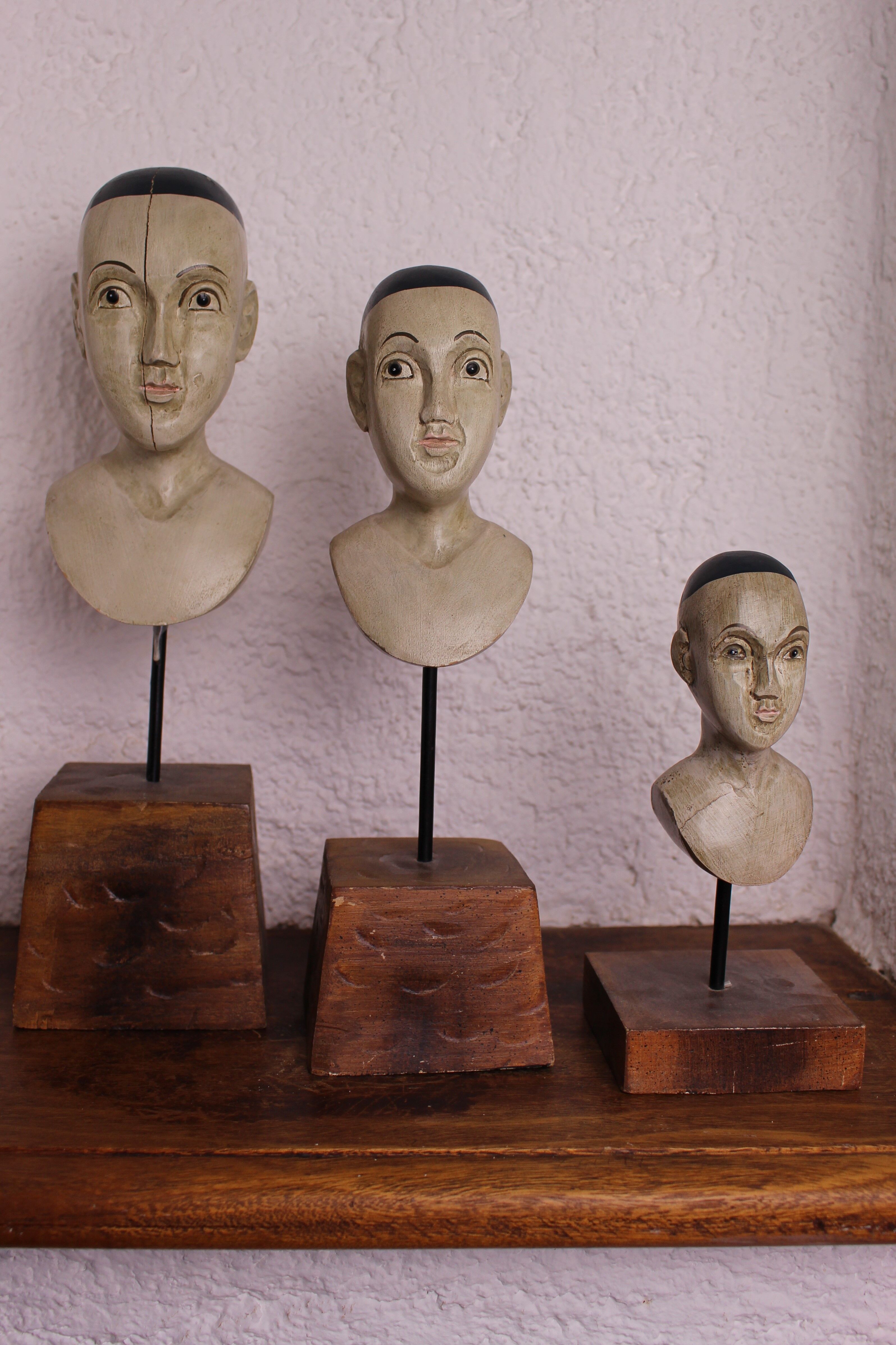 Trio of wooden busts