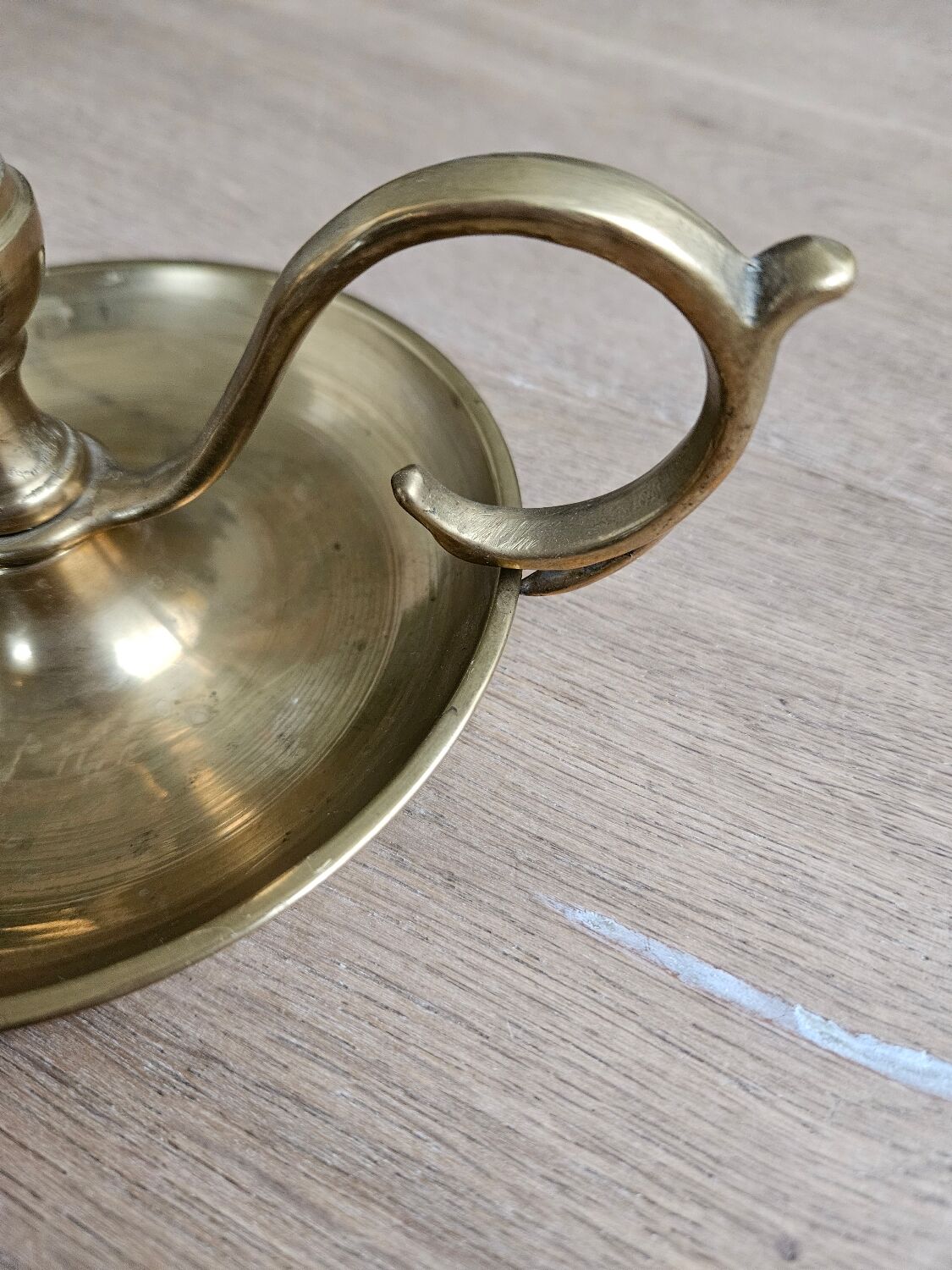 Hand candlestick with brass fitter