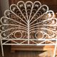 Rattan headboard & white wicker peacock tail décor 50-60s