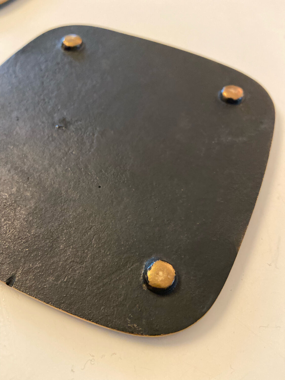 Set of three bronze mats