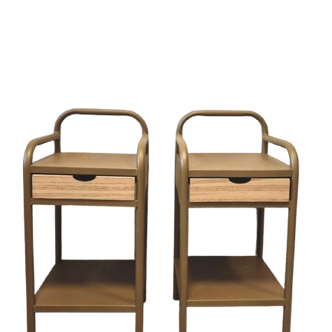 Old ochre metal bedside tables from a boarding school.