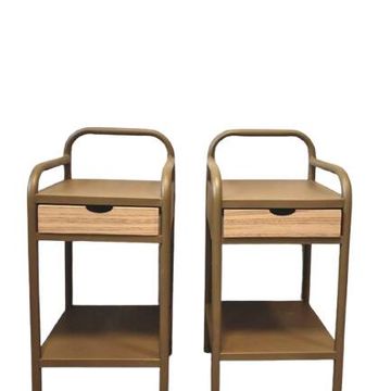 Old ochre metal bedside tables from a boarding school.