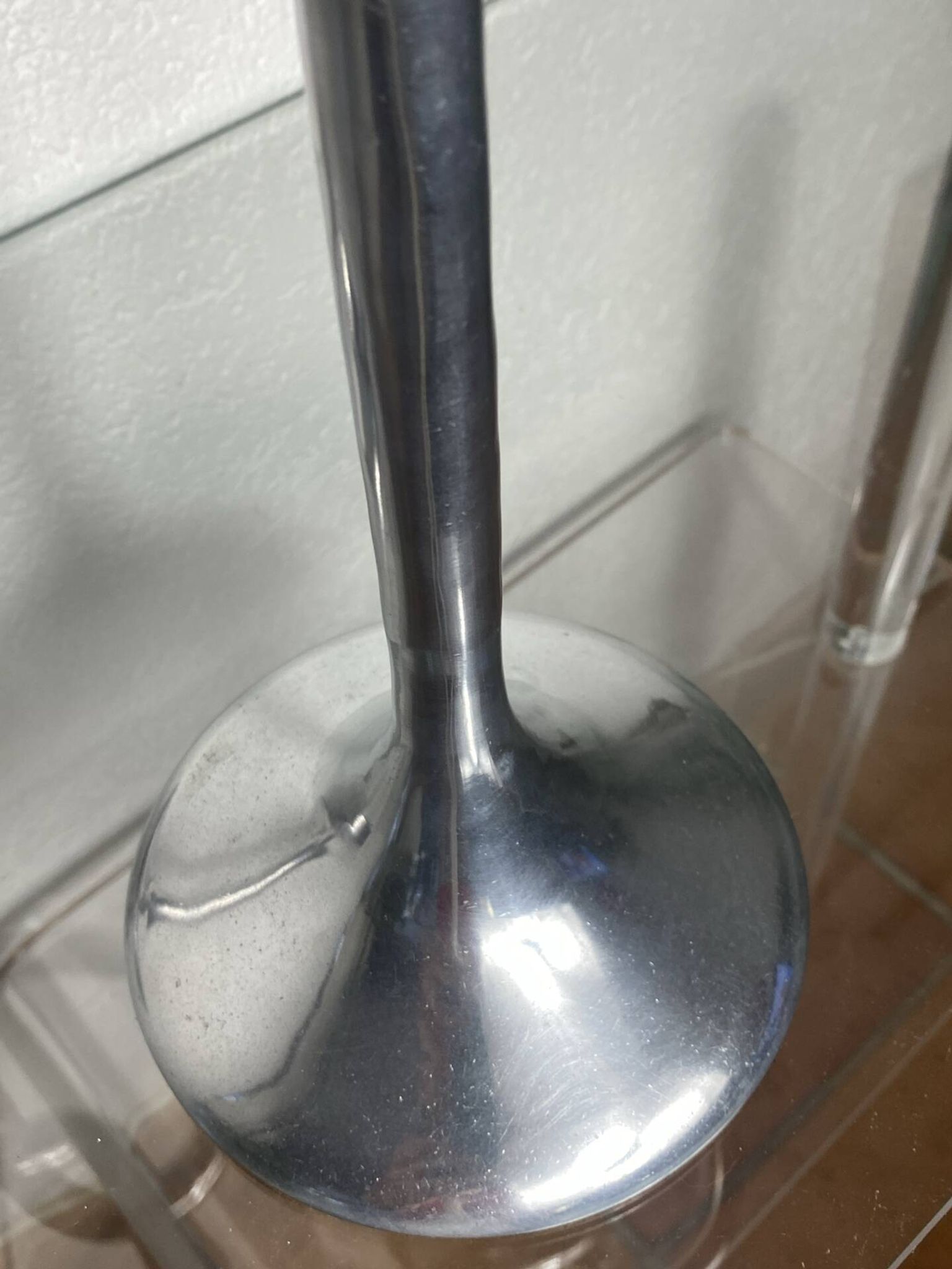 Pair of large aluminium bow candlesticks, Italy, 1970.