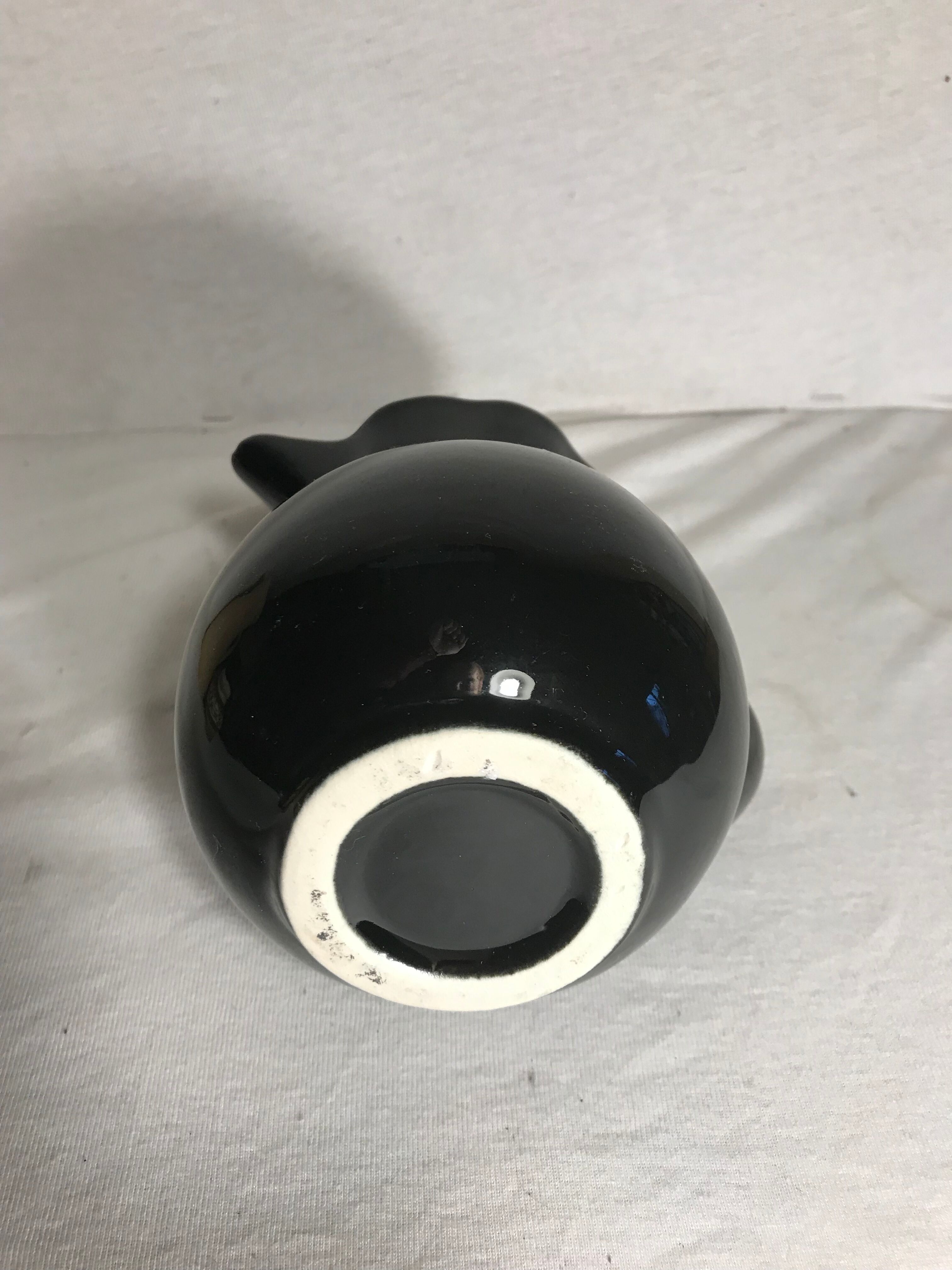 Former enamelled ceramic black pitcher 70s