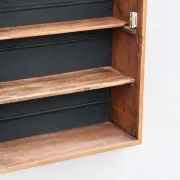 Antique wall display cabinet in natural wood and black – small glass-fronted collector's piece.