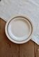 Plat de service rond vintage faïence ivoire à double liseré doré