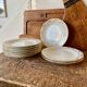 Set of 9 dessert plates in white and gold porcelain
