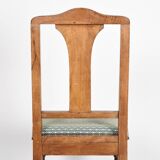 Set of 4 Art Deco chairs in carved wood.