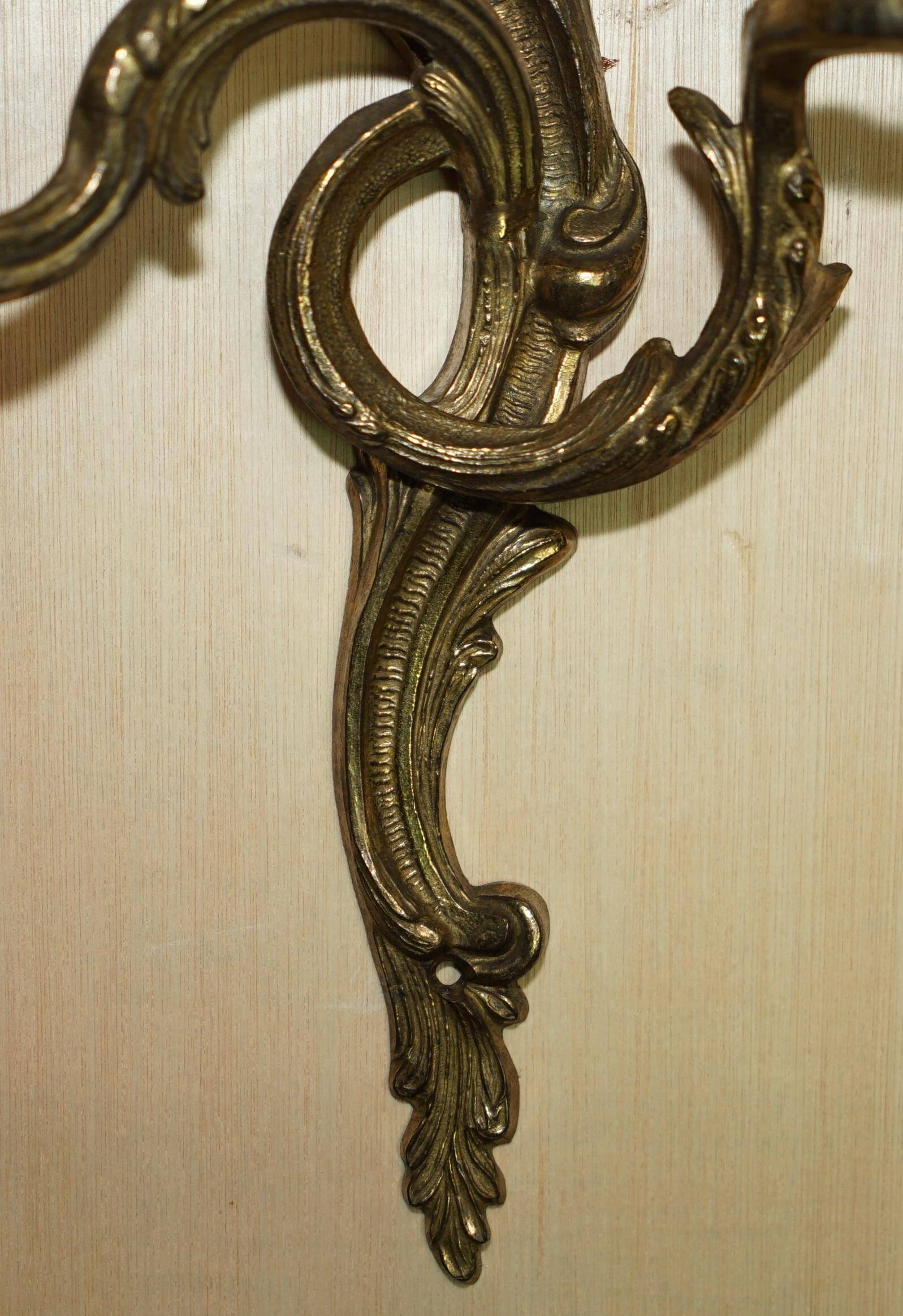Pair of antique wall sconces from the 1920s in gilded bronze.