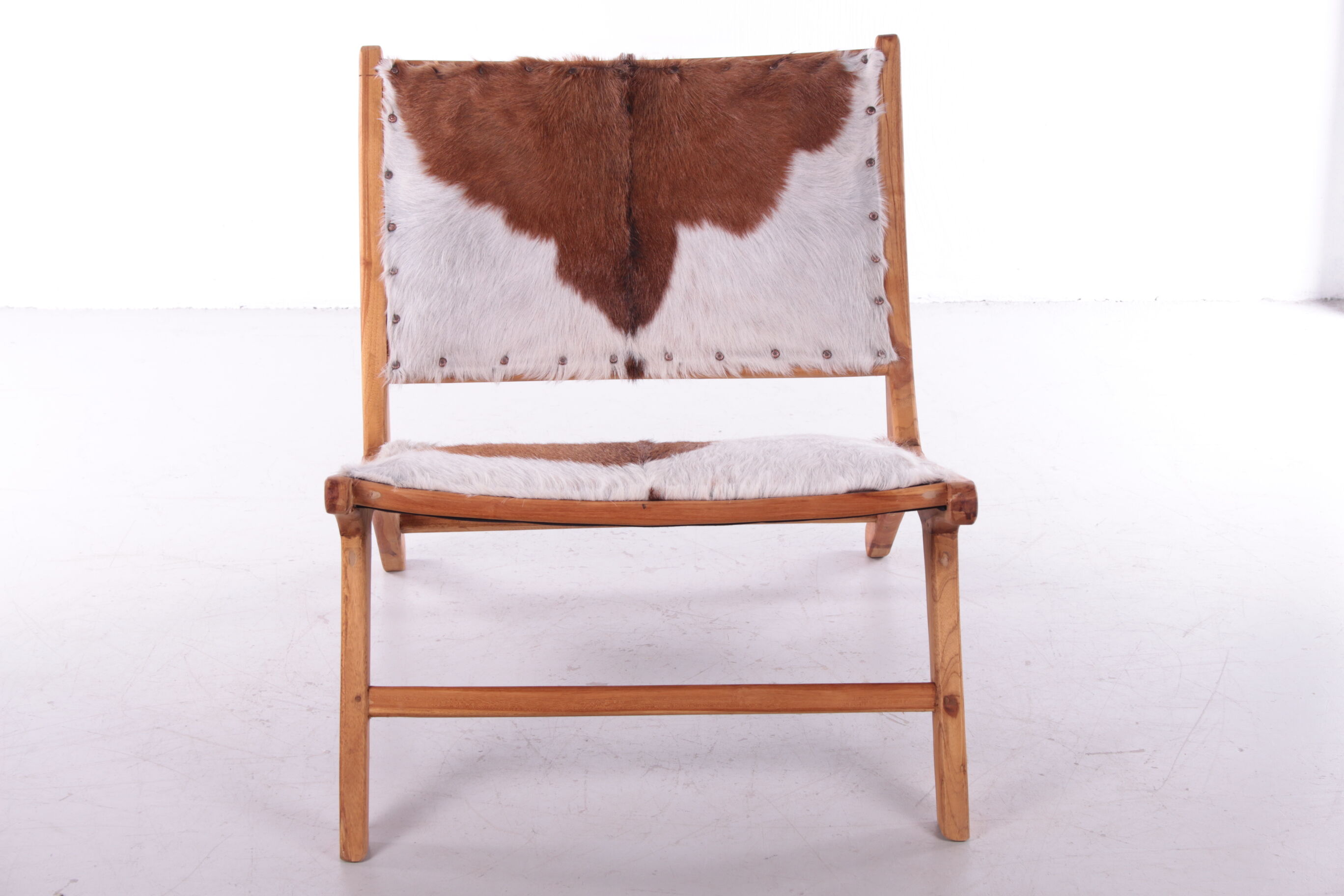 Vintage Relax chair upholstered with cowhide, 1970