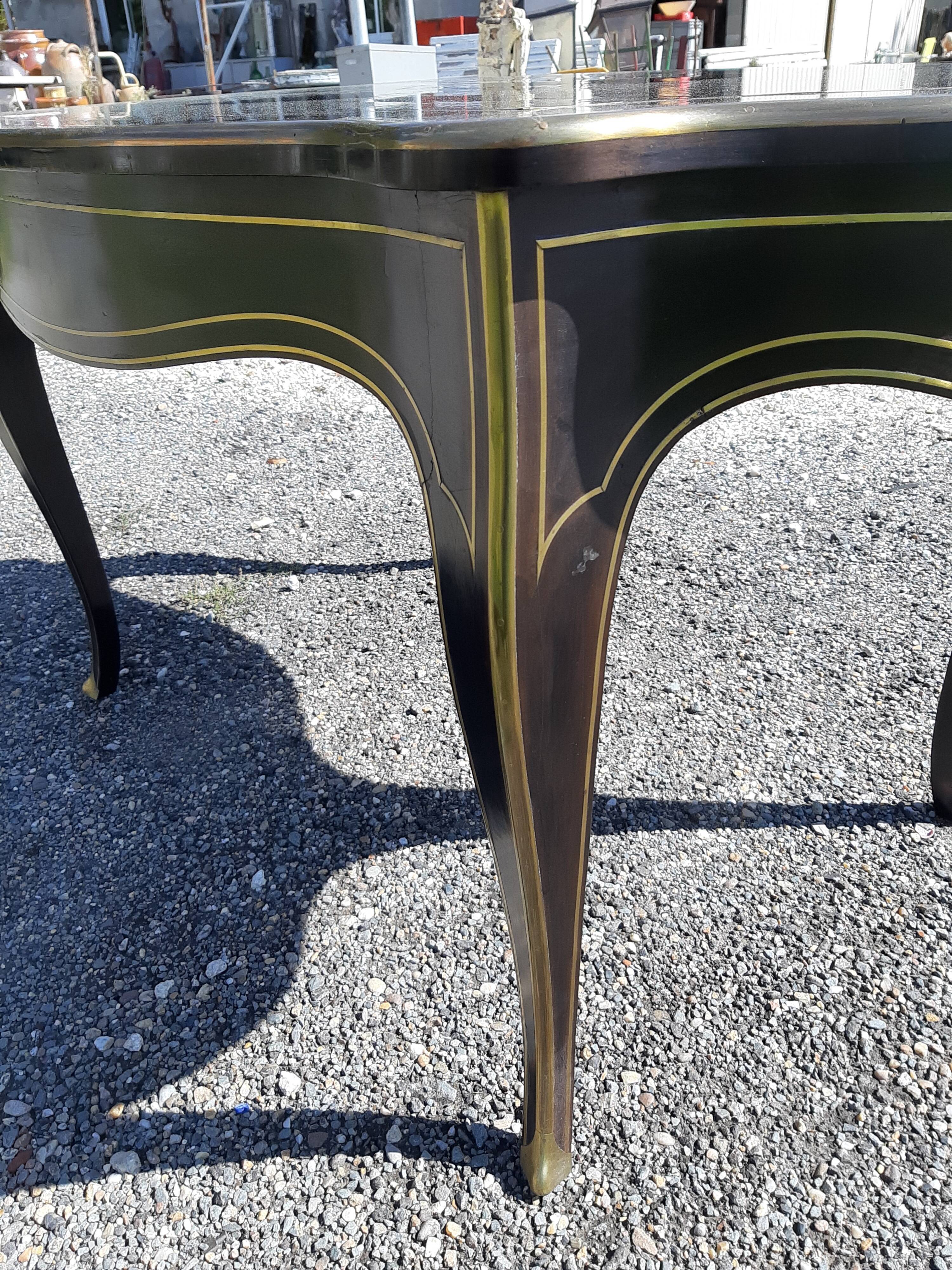 Napoleon III black lacquered wood and brass table