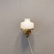 Older wall lamp, in metal, brass and milk-white glass