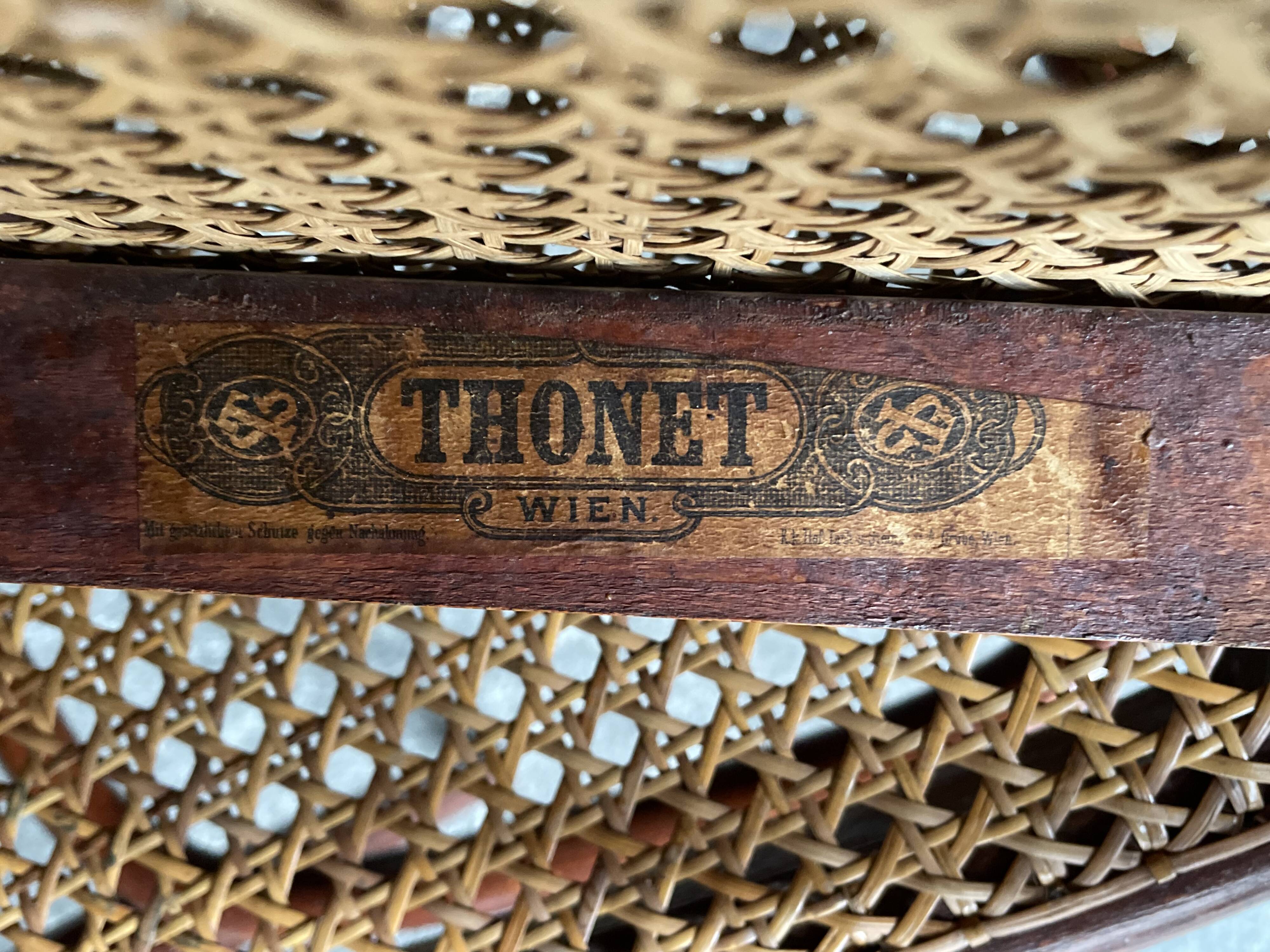Pair of caned bistro chairs by Thonet