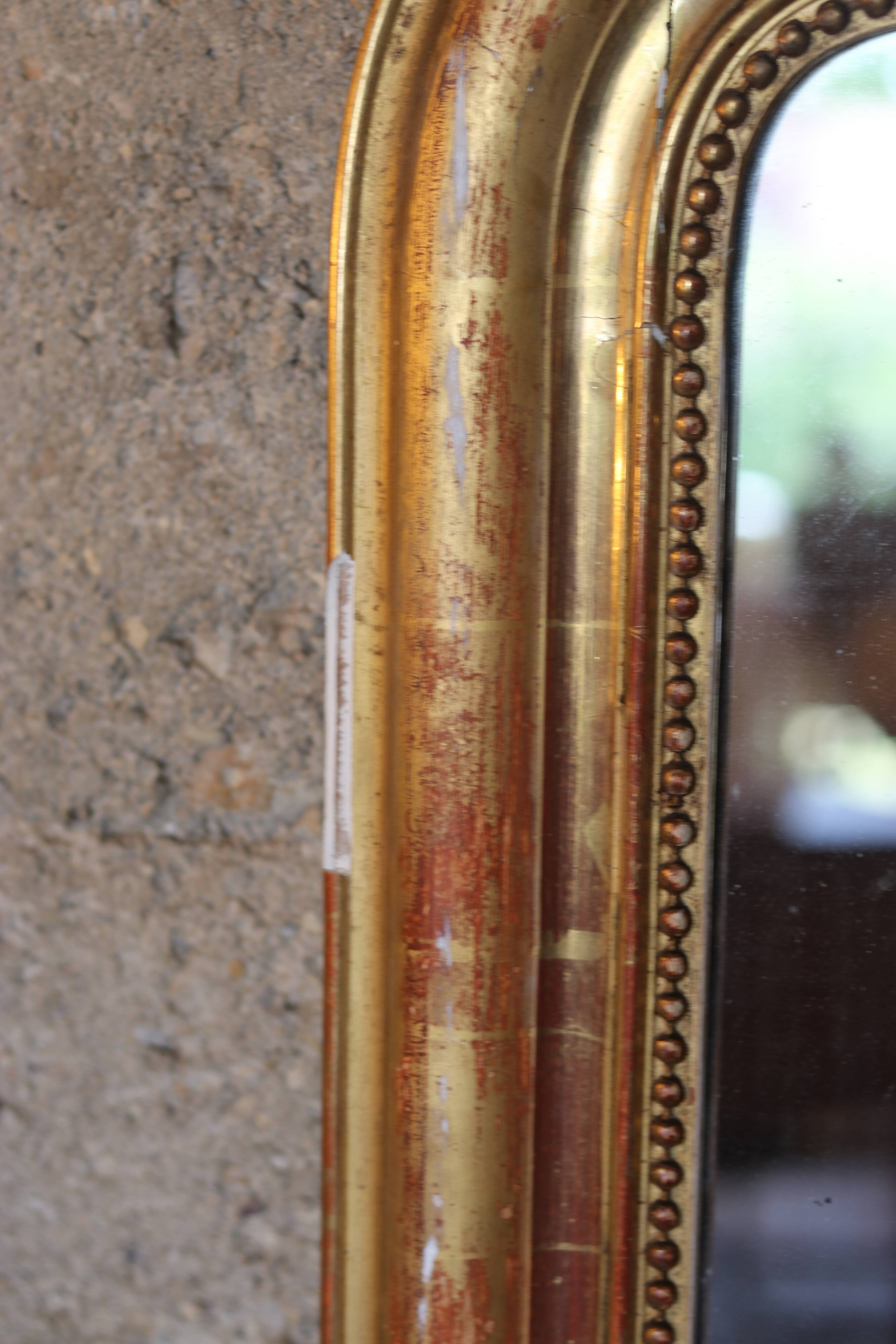 Large Louis XVI style mirror, wood and gilded stucco