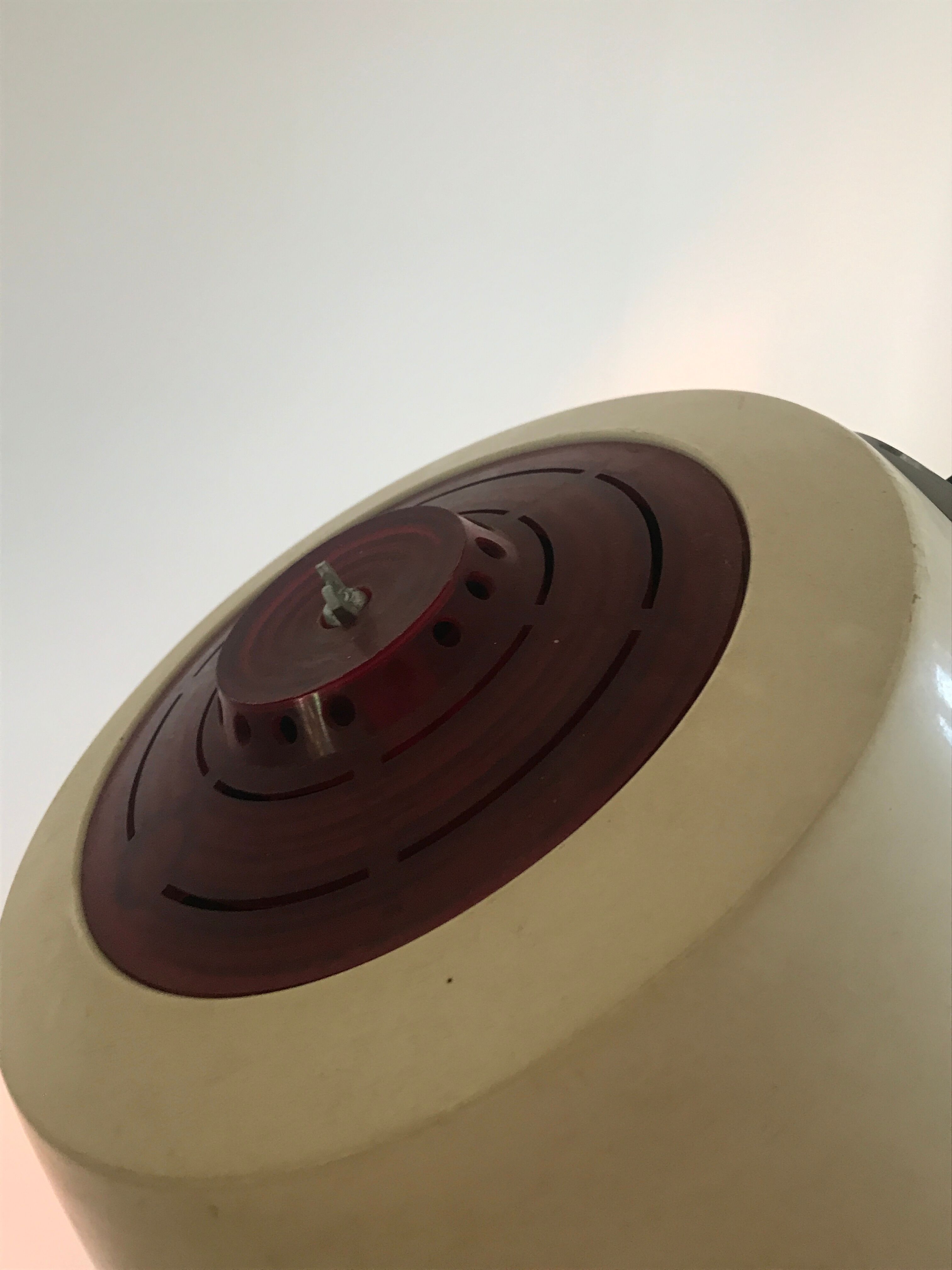 Vintage hairdresser's armchair with helmet transformed into a lamp