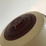 Vintage hairdresser's armchair with helmet transformed into a lamp