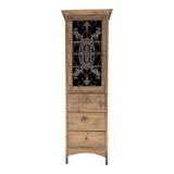 Column storage unit with a sculpted metal door.