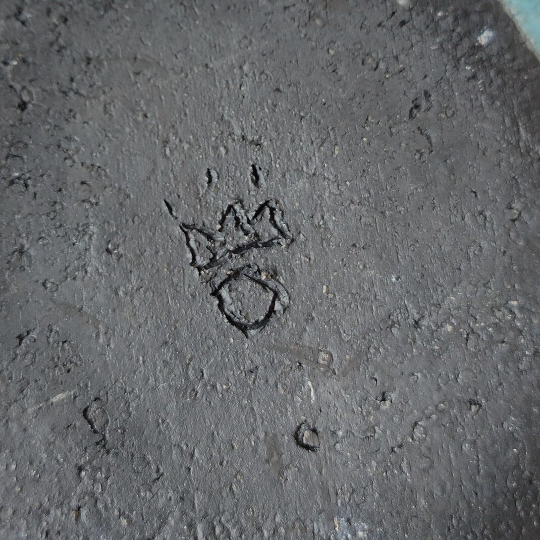 Empty turquoise raku pocket