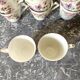 Antique flowered porcelain cups mismatched