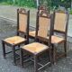 4 Basque solid wood dining chairs with carved straw seats.