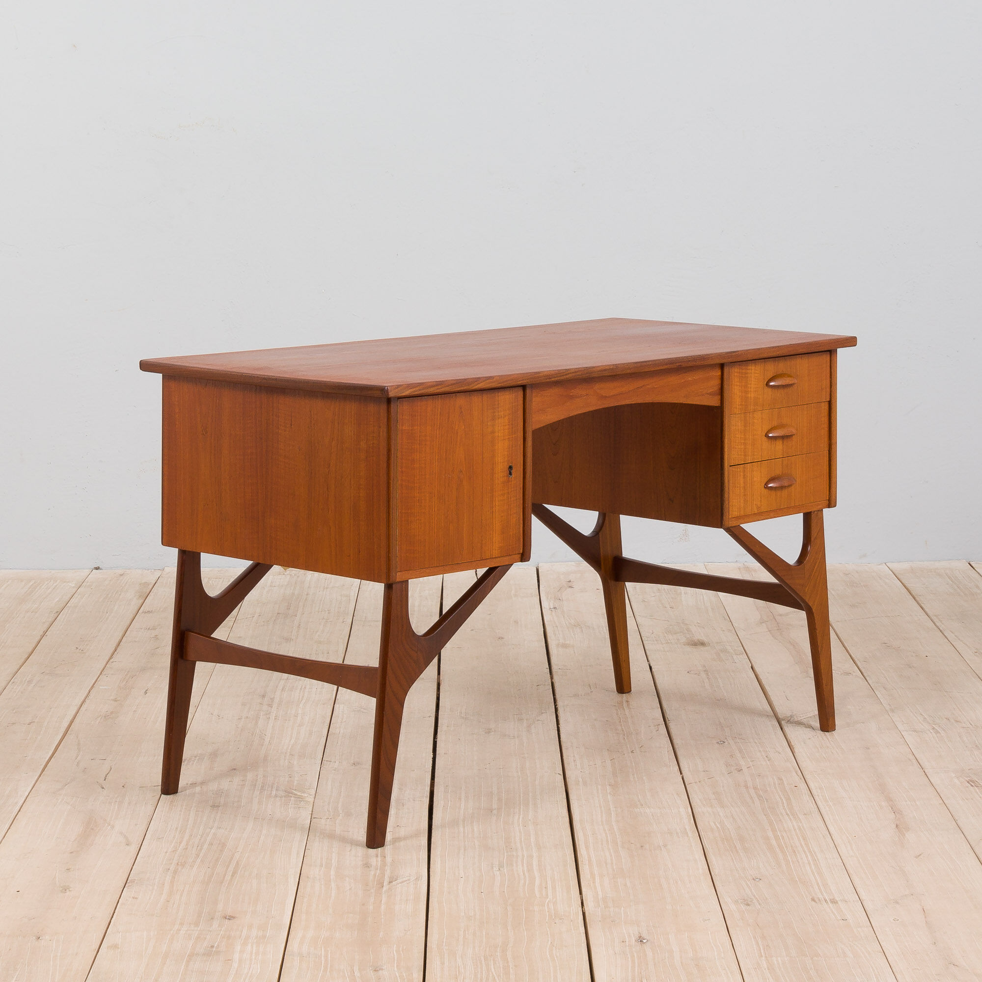Danish mid century teak desk on sculptural base, 1960s.