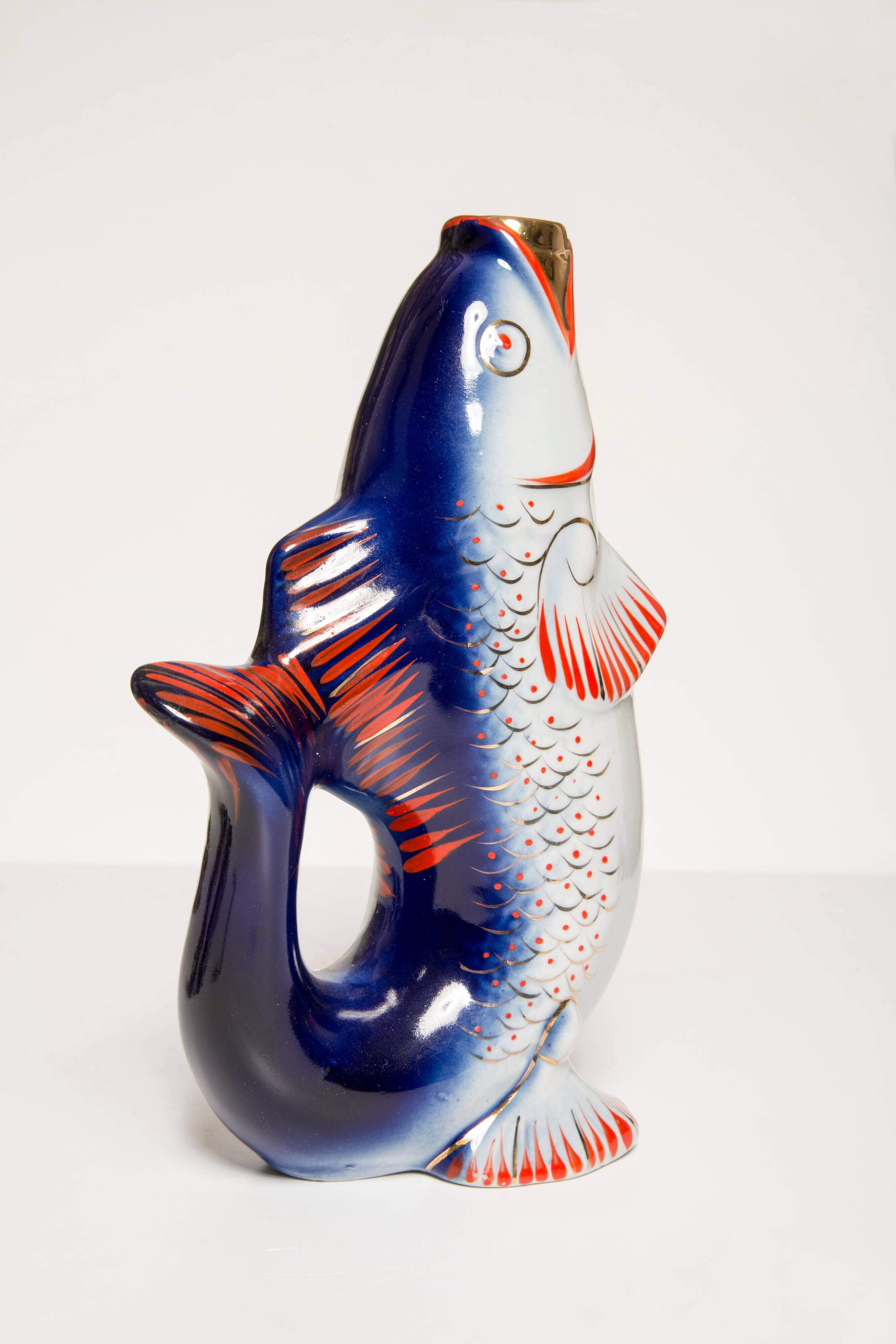 Set of 7 glasses and a glass carafe decorated with blue fish, Mid-Century Modern style, Europe, 1960s.