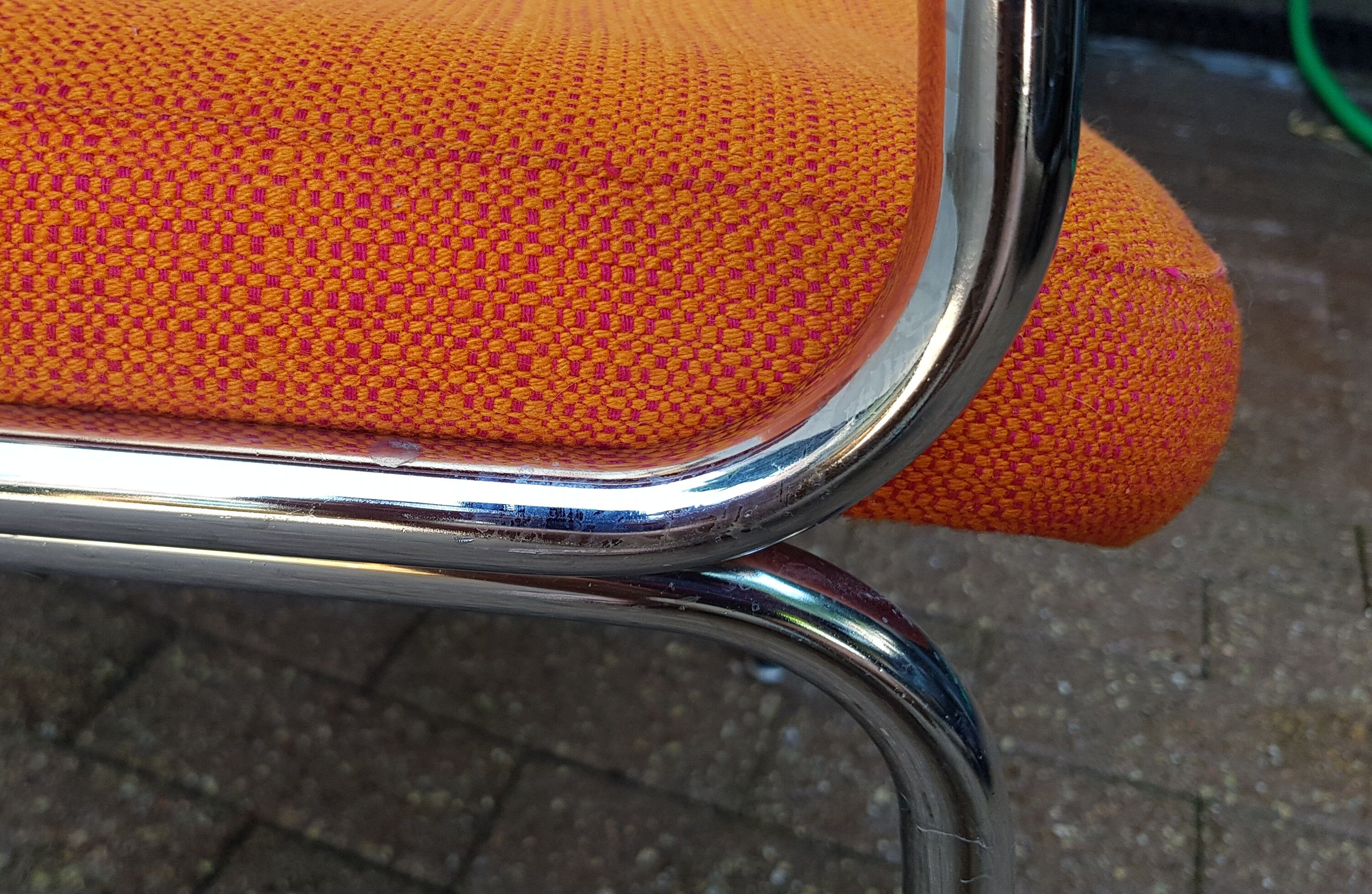 Orange fabrics and chrome armchair 70