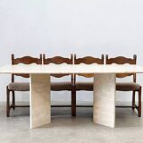 Sculptural travertine dining table