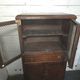 Vintage oak furniture with mesh doors.