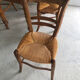 Round wooden table (4/6 people) with 4 straw chairs
