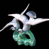 Old barbotine statue seagulls on the wave