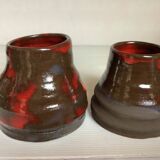 Pair of red vases in the shape of an elephant's foot