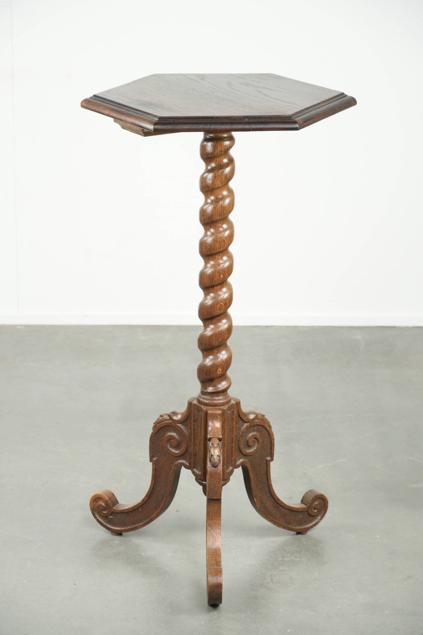 Antique tall oak plant/side table with wood carving and a turned leg
