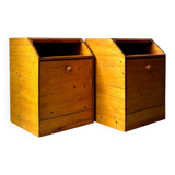 Pair of handcrafted solid wood bedside tables with drop-down doors.