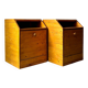 Pair of handcrafted solid wood bedside tables with drop-down doors.