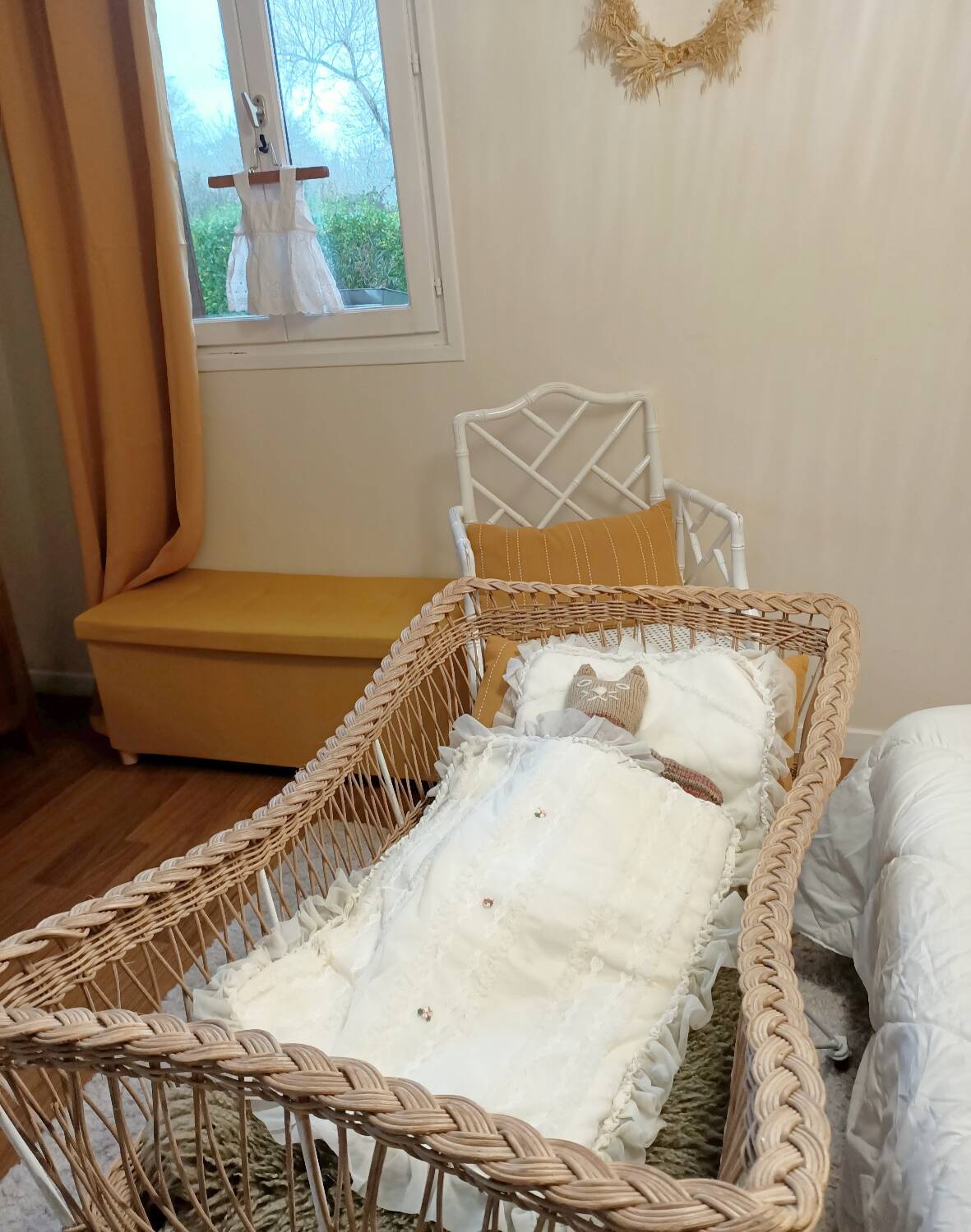 Rattan and wrought iron cradle