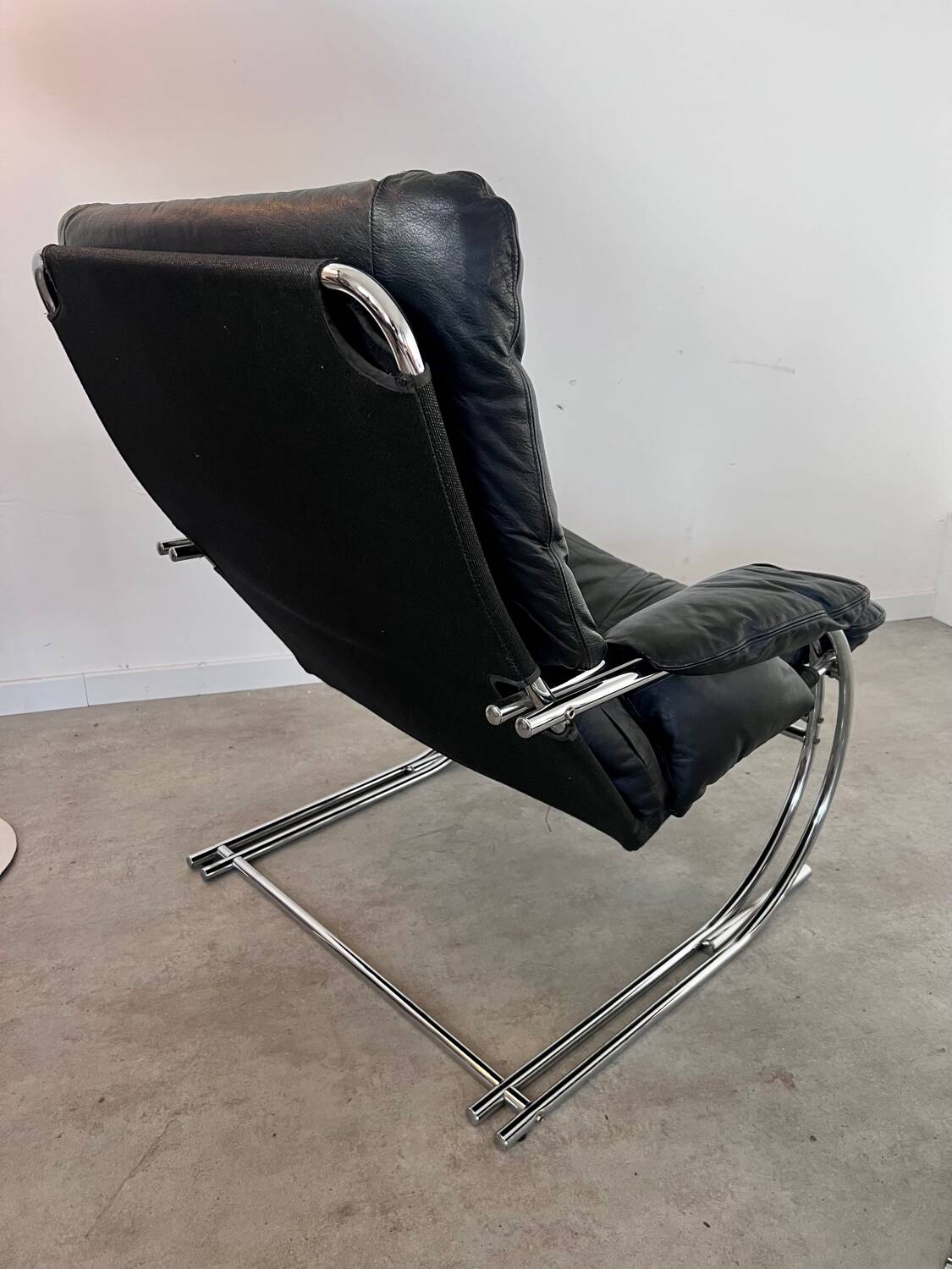 Old armchair and ottoman black leather tubular chrome bauhaus design from the 70s