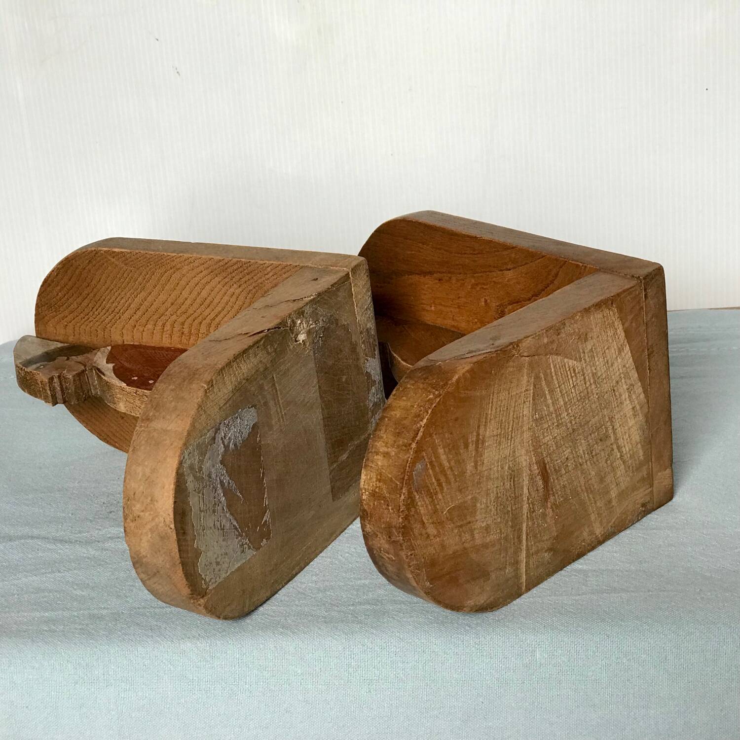 Old wooden bookends with painted characters