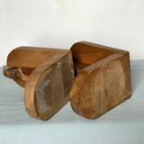 Old wooden bookends with painted characters