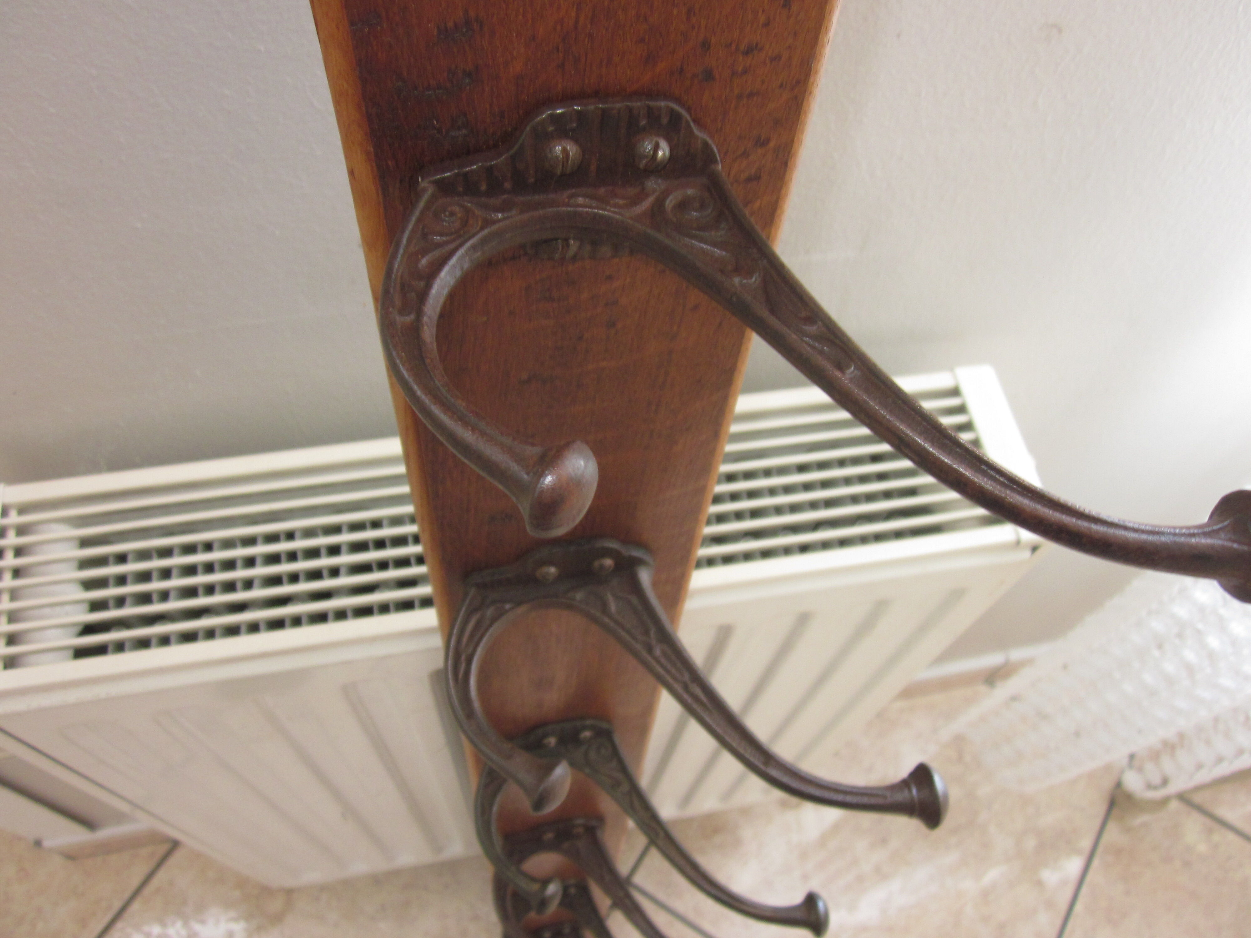 Bistro coat rack has 6 cast iron pads