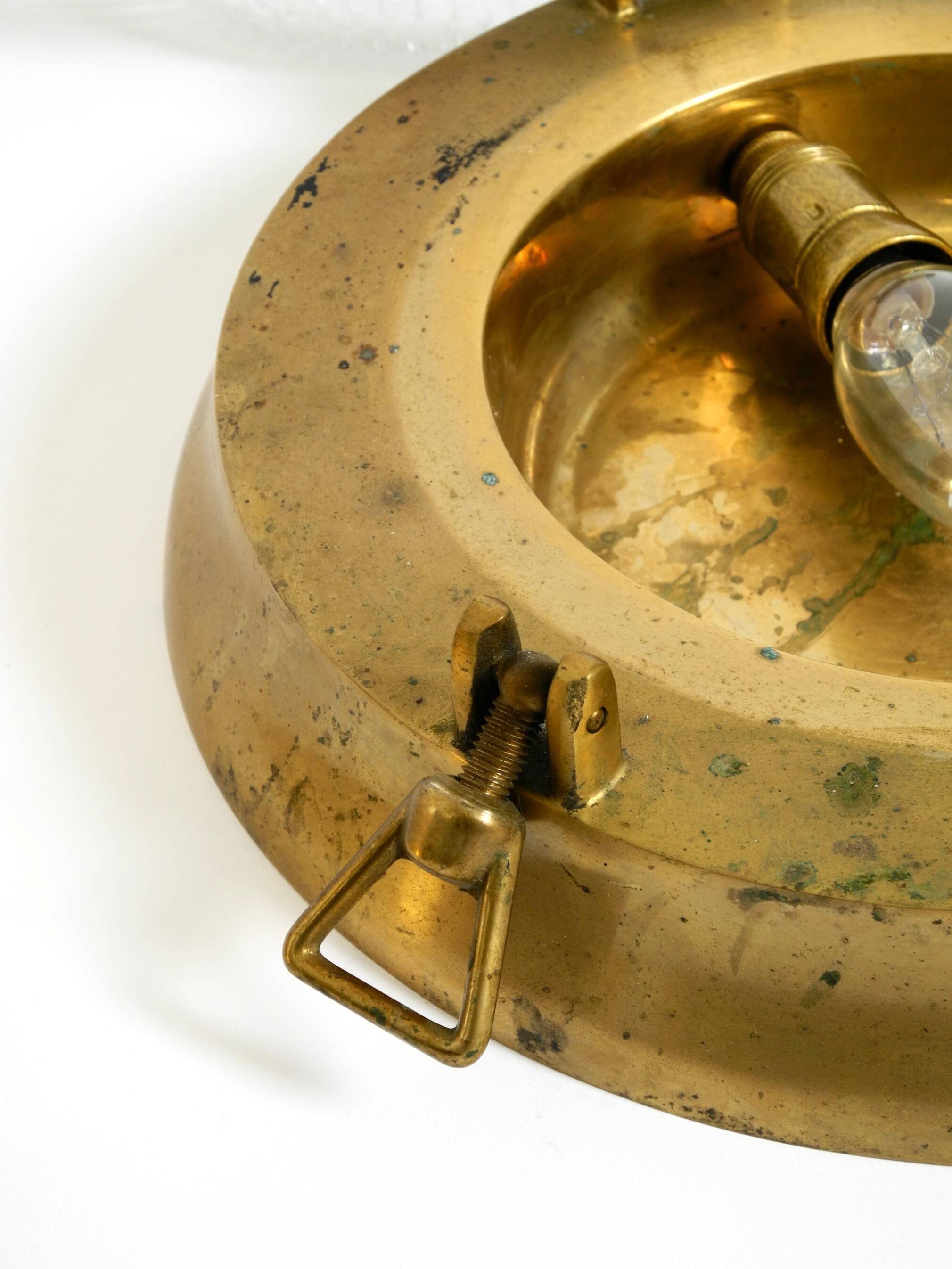 A pair of large, heavy 50s maritime ship wall lamps made of brass and glass