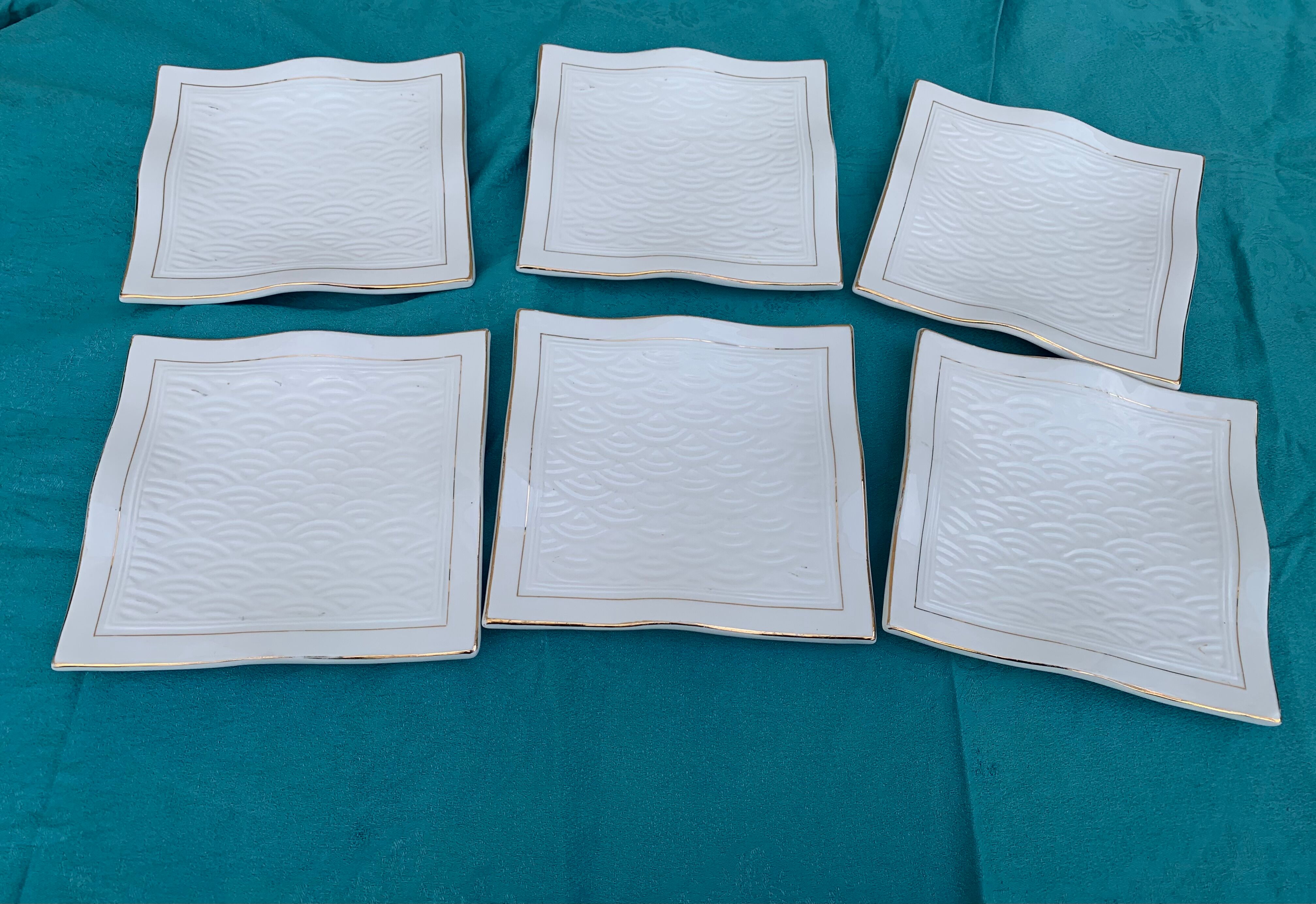 6 white glazed ceramic plates vague design and contemporary patterns