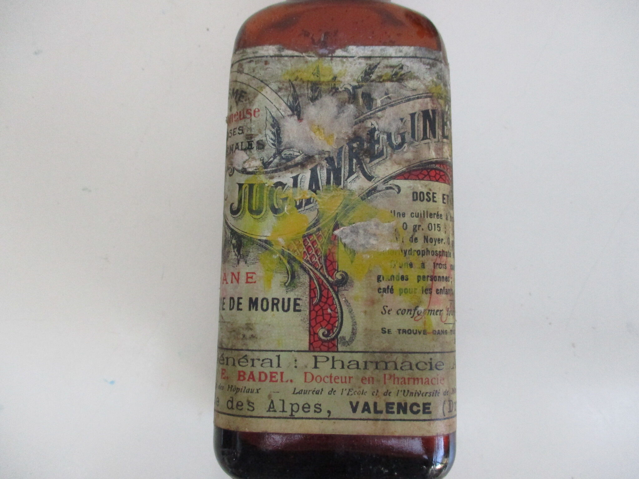 2 amber glass bottles with their old labels